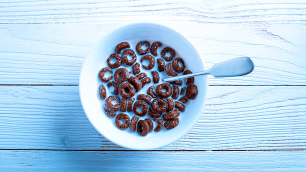 istock Cereal for Breakfast is on the table. Delicious rings from milk 874395864