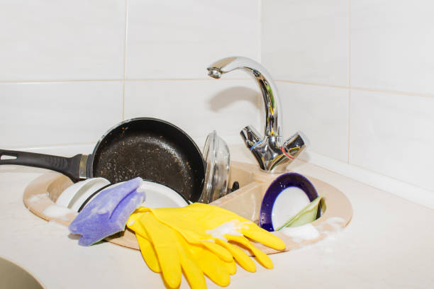 huge heap of dirty dishes waiting for the flatmate huge heap of dirty dishes waiting for the flatmate. flatmate stock pictures, royalty-free photos & images