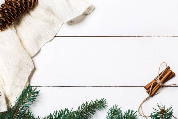 istock Christmas composition. pine cones, fir branches on wooden white background. Flat lay, top view 874399618