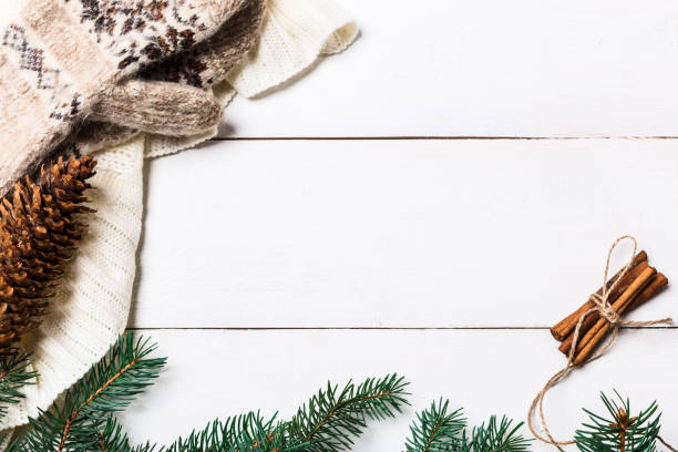 istock Christmas composition. pine cones, fir branches on wooden white background. Flat lay, top view 874399726