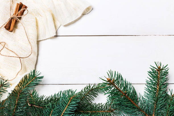 istock Christmas composition. pine cones, fir branches on wooden white background. Flat lay, top view 874401864