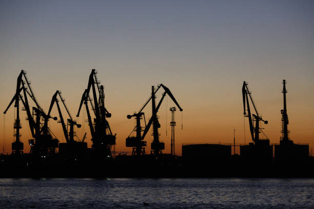 istock Many big cranes in night Berdiansk, Ukraine 874402194