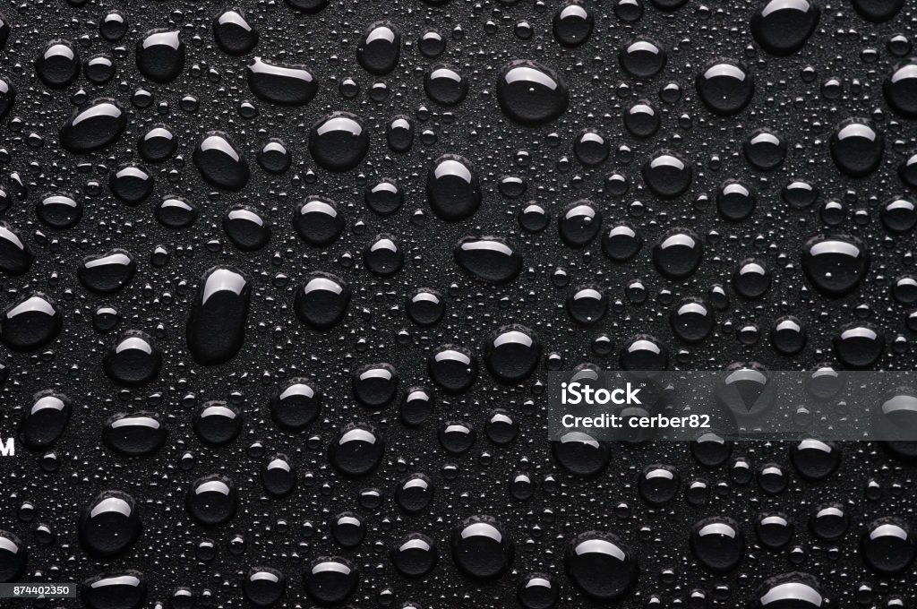 Water drops on black background Black Background Stock Photo