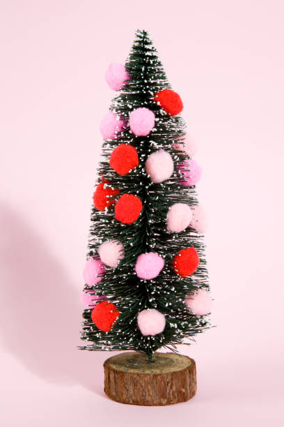 istock snowy christmas tree decorated with pompoms 874403724