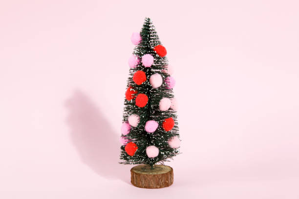 istock snowy christmas tree decorated with pompoms 874403728