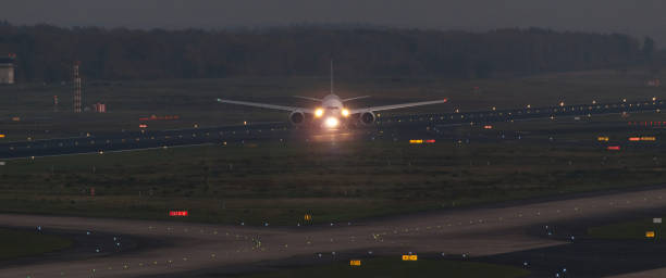 istock passenger airplane on an airport runway in the evening 874403812