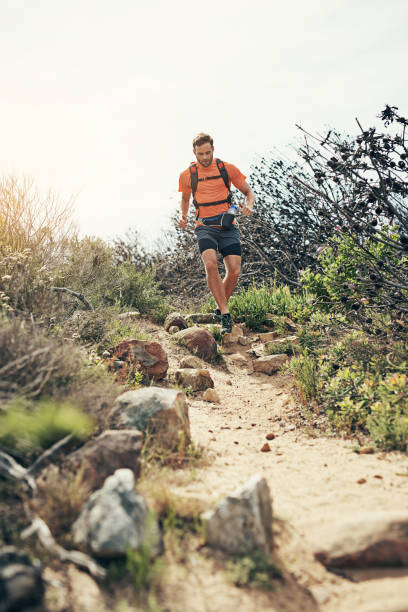 istock Tackling the trail with all he's got 874407062