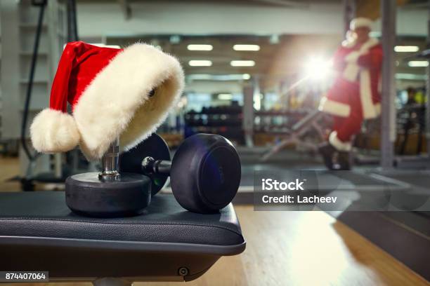 Santas Hat In The Gym Stock Photo - Download Image Now - Christmas, Exercising, Gym