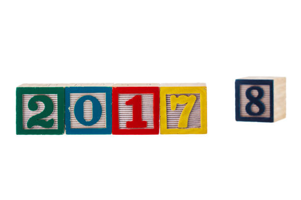 istock New Year 2017 written on wooden blocks on white background 874412576