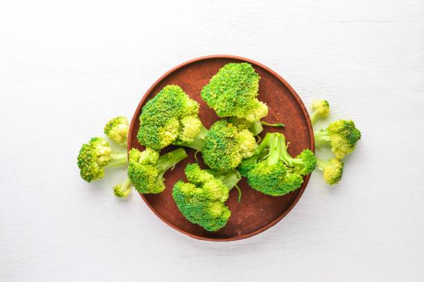 istock Broccoli On a wooden background. Top view. Free space. 874412668