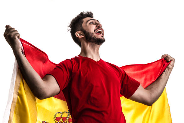 istock Spanish athlete / fan celebrating on white background 874418216