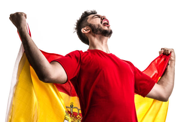 istock Spanish athlete / fan celebrating on white background 874418226