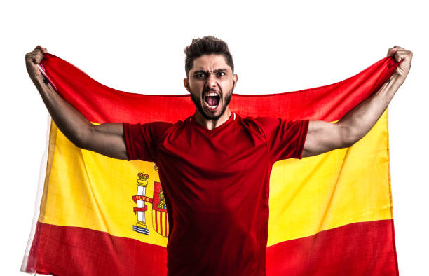 istock Spanish athlete / fan celebrating on white background 874418246