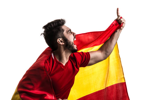 istock Spanish athlete / fan celebrating on white background 874418260
