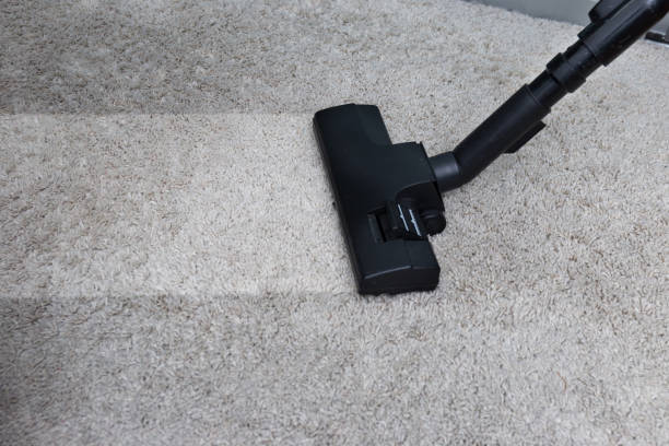 istock Cleaning Service man cleaning  floor with machine on Carpet to work 874418830