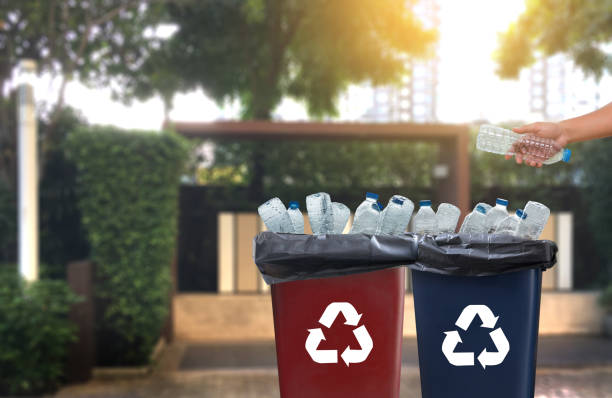 istock man hand putting plastic reuse  for recycling concept environmental protection world recycle 874418832