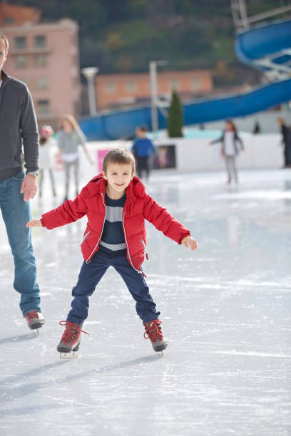 istock Happy boy with red hat, skating during the day, having fun 874419174
