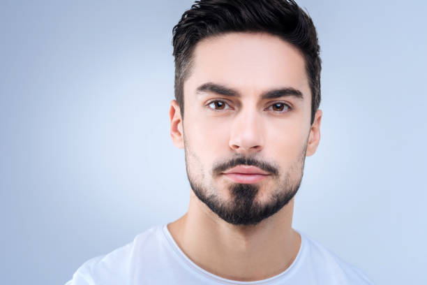 istock Sensitive portrait of a handsome man looking calm and self assured 874423912