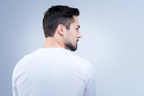 istock Serious bearded man looking to the right while turning away 874431374
