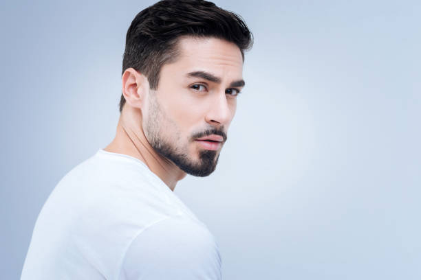 istock Handsome young man being interested in the discussion not far from him 874431554