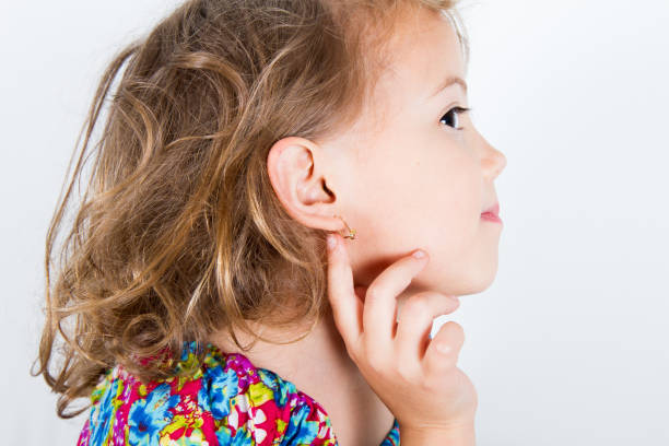 little girl with earring stock photo