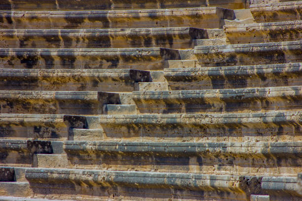 The Aspendos Theatre in Turkey is a remarkably well-preserved Roman-era theater, known for its excellent condition and architectural integrity. Built in 155 AD under Emperor Marcus Aurelius, it features a horseshoe-shaped seating area carved into a hillside, a magnificent stage building, and once seated approximately 13,000 spectators, with modern events accommodating over 20,000. It is considered one of the most intact and distinguished examples of Roman theater architecture in the world.