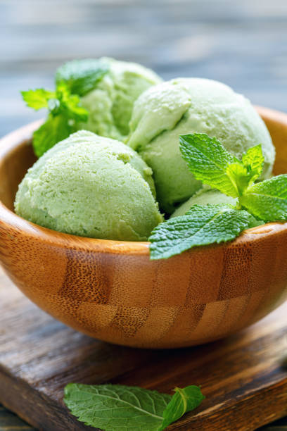 istock Balls with mint ice cream in a wooden bowl. 874446094