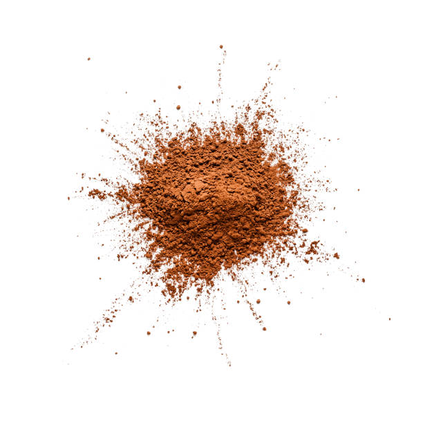 Cocoa powder heap shot from above on white bachground Top view of a heap of organic cocoa powder shot on white background. DSRL studio photo taken with Canon EOS 5D Mk II and Canon EF 100mm f/2.8L Macro IS USM cocoa powder stock pictures, royalty-free photos & images