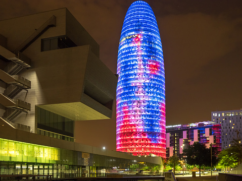 BARCELONA, SPAIN - JULY 24, 2015: Night view of the Agbar tower constructed in 2005. Since then it's a Barcelona landmark.