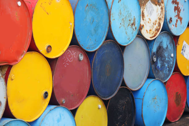 istock stack of grunge industrial barrels background. 874456968