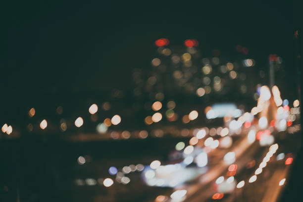 istock Defocused different color night lights of the city 874468708
