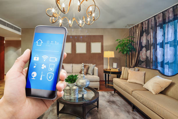 istock smart phone with smart home with modern living room 874469332