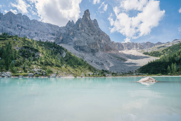 istock Alpine lake and Dolomites, Italy 874473948