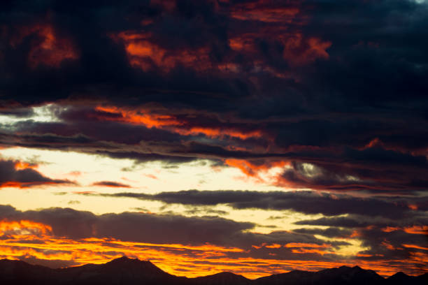 istock Orange and gold sunset over the Rocky Mountains 874474790