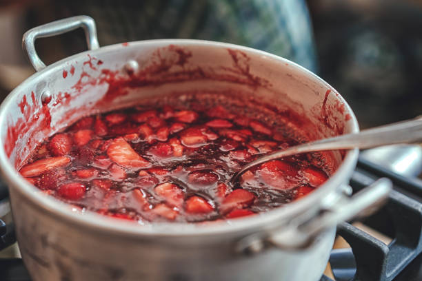 Preparing Homemade Strawberry Jam and Canning in Jars