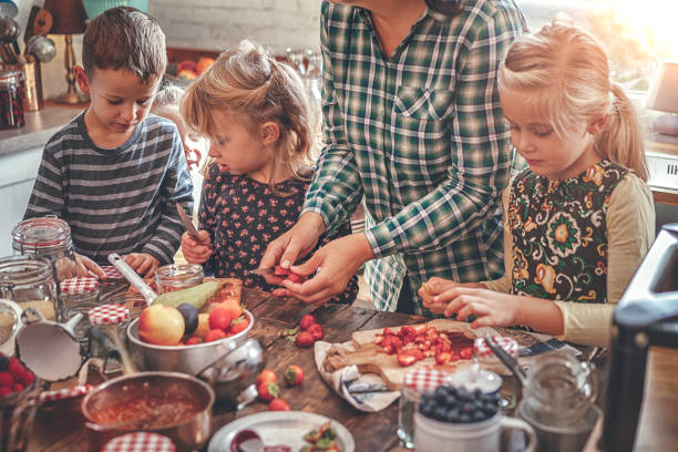 istock Preparing Homemade Berry Jam and Canning in Jars 874486830