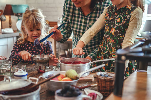 istock Preparing Homemade Berry Jam and Canning in Jars 874486836