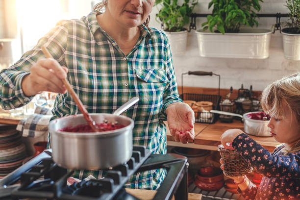 istock Preparing Homemade Berry Jam and Canning in Jars 874486848