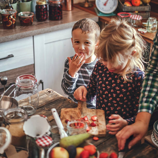 istock Preparing Homemade Strawberry Jam and Canning in Jars 874486854