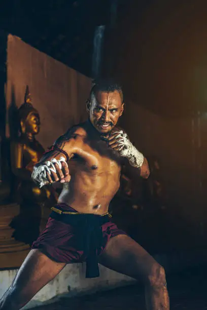 Photo of Ancient Thai boxers are practicing with intention.Thai temples are accessible to the public. In Ayutthaya Thailand