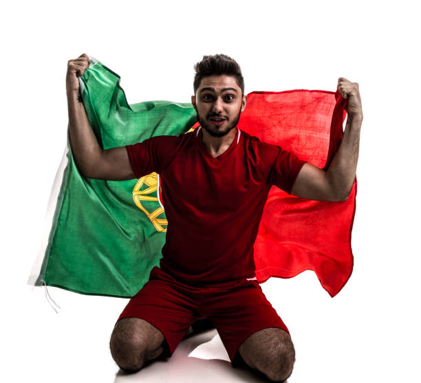 istock Portuguese athlete / fan celebrating on white background 874497408