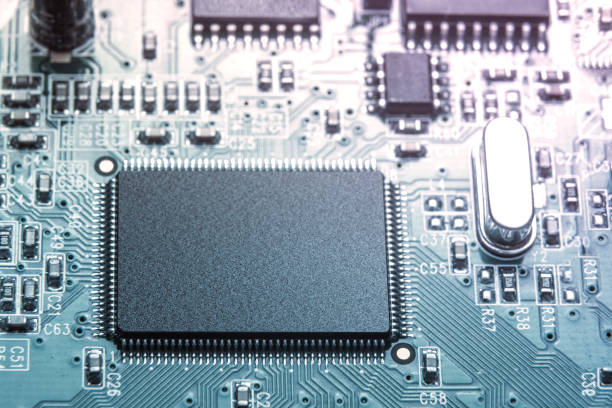 istock Close-up of green toned electronic computer chip on motherboard 874498518