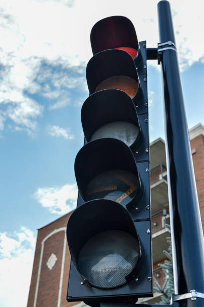 istock Traffic light in Montreal downtown among the buildings 874503504