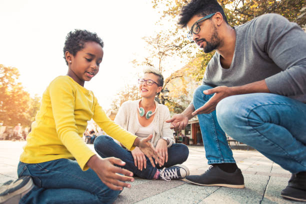 istock Happy young mixed race couple spending time with their daughter 874503552