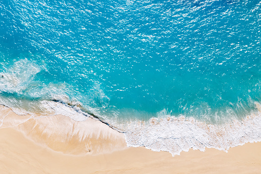 Aerial view to tropical sandy beach and blue ocean