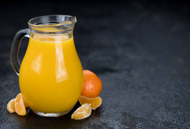 istock Fresh made Tangerine Juice (close-up shot) 874514926