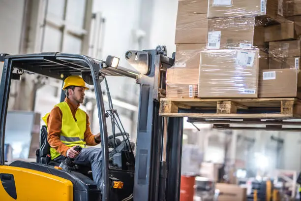 Photo of Manual worker working in warehouse