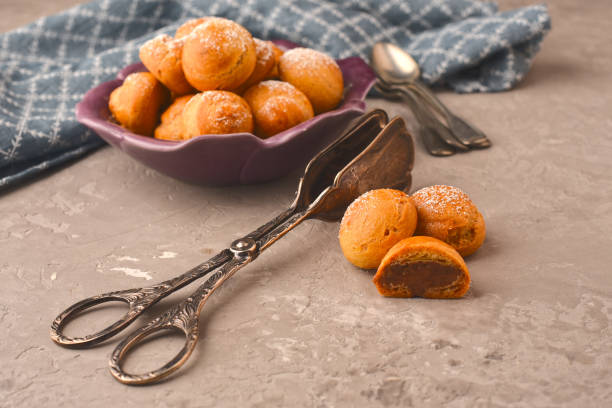 istock Choux pastry with chocolate cream 874518626