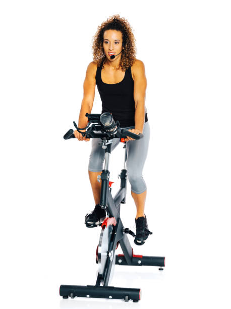 istock Woman on an Exercise Bike 874523194