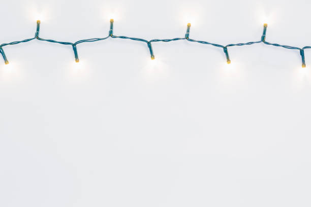 istock Christmas lights on the wite paper 874526182